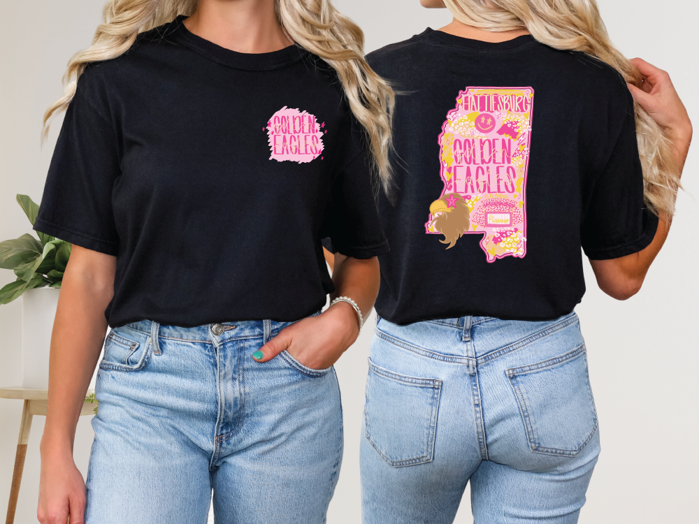 two women wearing black shirts with pink and yellow designs