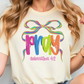 A woman wearing a white t-shirt with a colorful graphic design that says "Pray" and "Colossians 4:2".