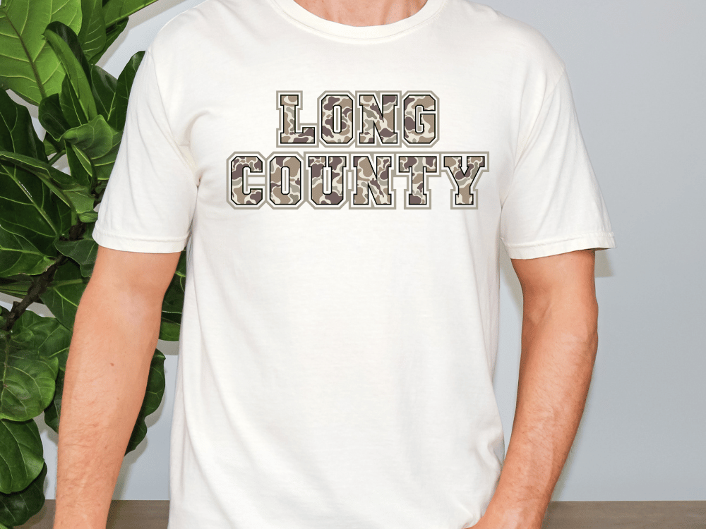 A person wearing a white t-shirt with the text "LONG COUNTY" printed on it.