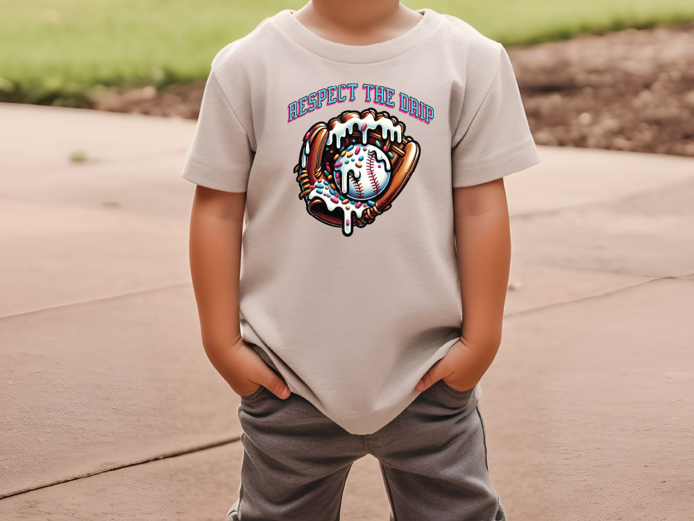 a young boy wearing a t - shirt with a baseball glove on it