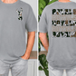 a man wearing a gray t-shirt with a camouflage pattern and the text "ROYALS ROYALS ROYALS" printed on the back.