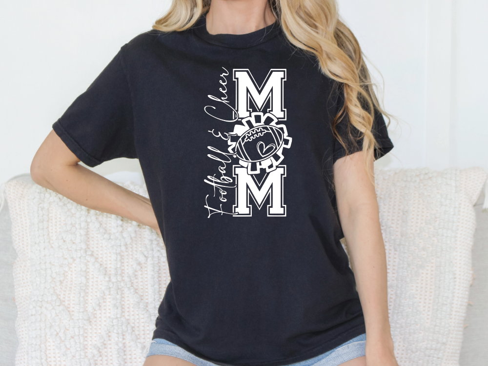 a woman wearing a black t - shirt with the letter m on it