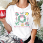 a woman holding a cup of hot chocolate in front of a christmas tree