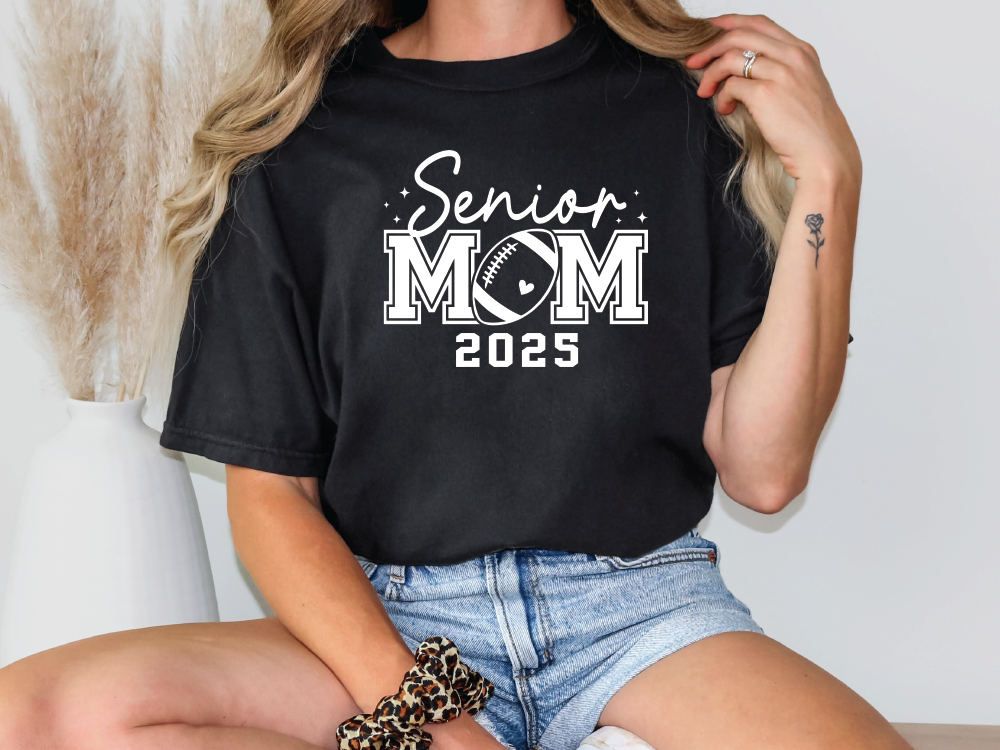 a woman wearing a black shirt that says senior mom