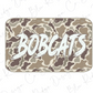 A camouflage-patterned object with the word "BOBCATS" written on it in a stylized font.