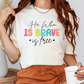 a woman wearing a t - shirt that says he who is brave is true