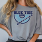 a woman wearing a blue tide wrestling t - shirt