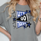 A woman wearing a gray t-shirt with a graphic design that says "Let's go Tigers".