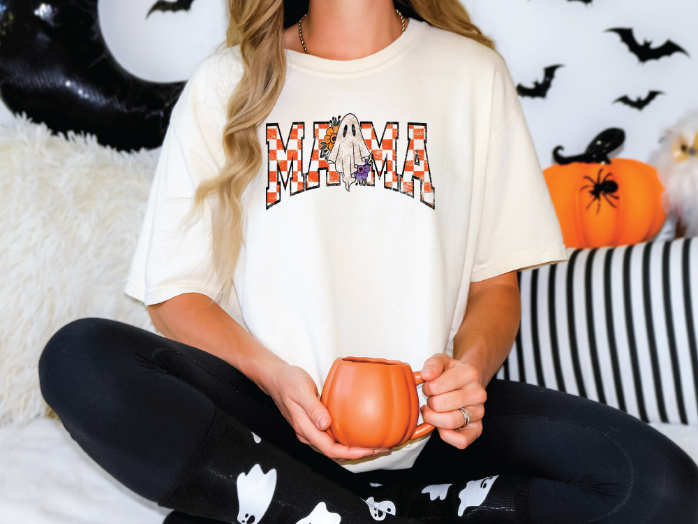 a woman sitting on a bed holding a pumpkin