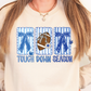 A woman wearing a white sweatshirt with a graphic design featuring a football, blue bows, and the text "TOUGH DOWN SEASON".