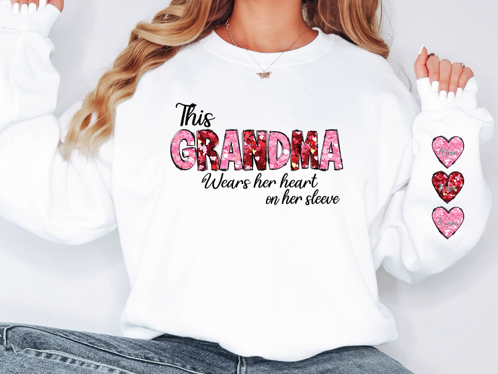 a woman wearing a white shirt with the words grandma on it