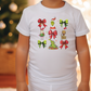 a little girl wearing a white shirt with christmas decorations on it