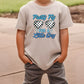 a young boy wearing a t - shirt with glasses on it