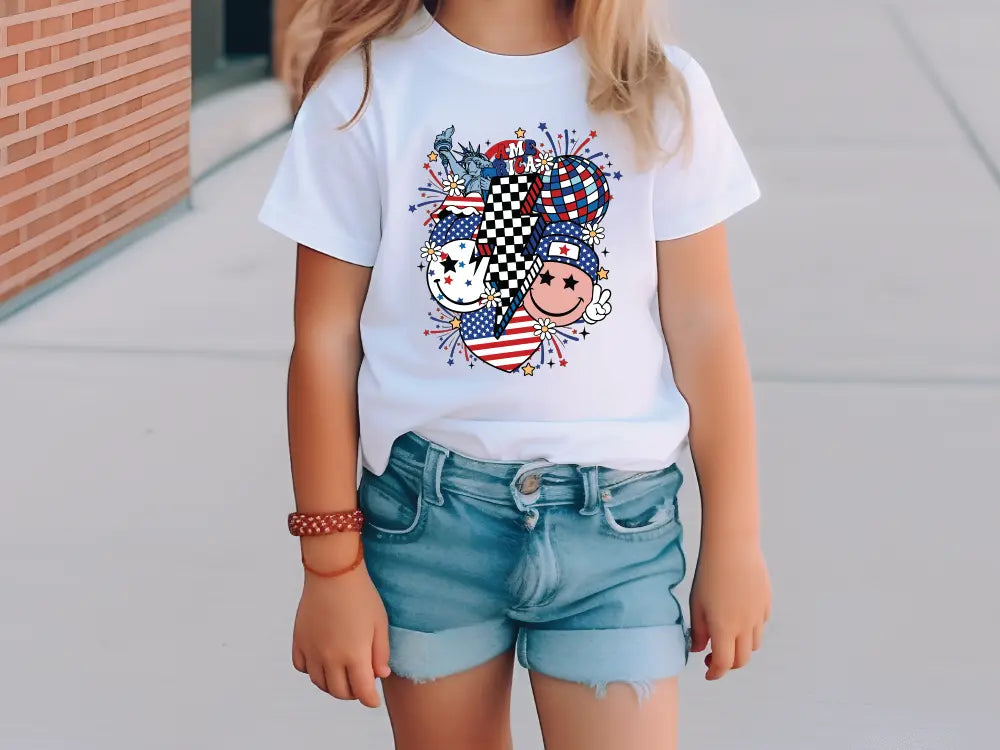 a little girl standing on a sidewalk wearing a t - shirt with a picture of