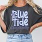 A woman wearing a gray t-shirt with the text "Blue Tide Long County" printed on it.