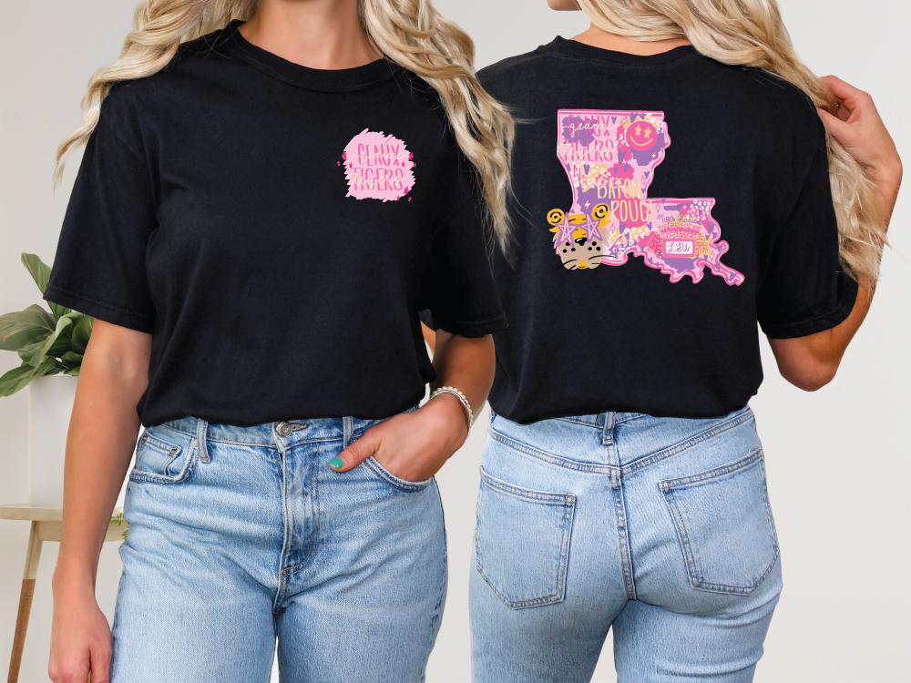 two women wearing black t - shirts with pink and yellow designs