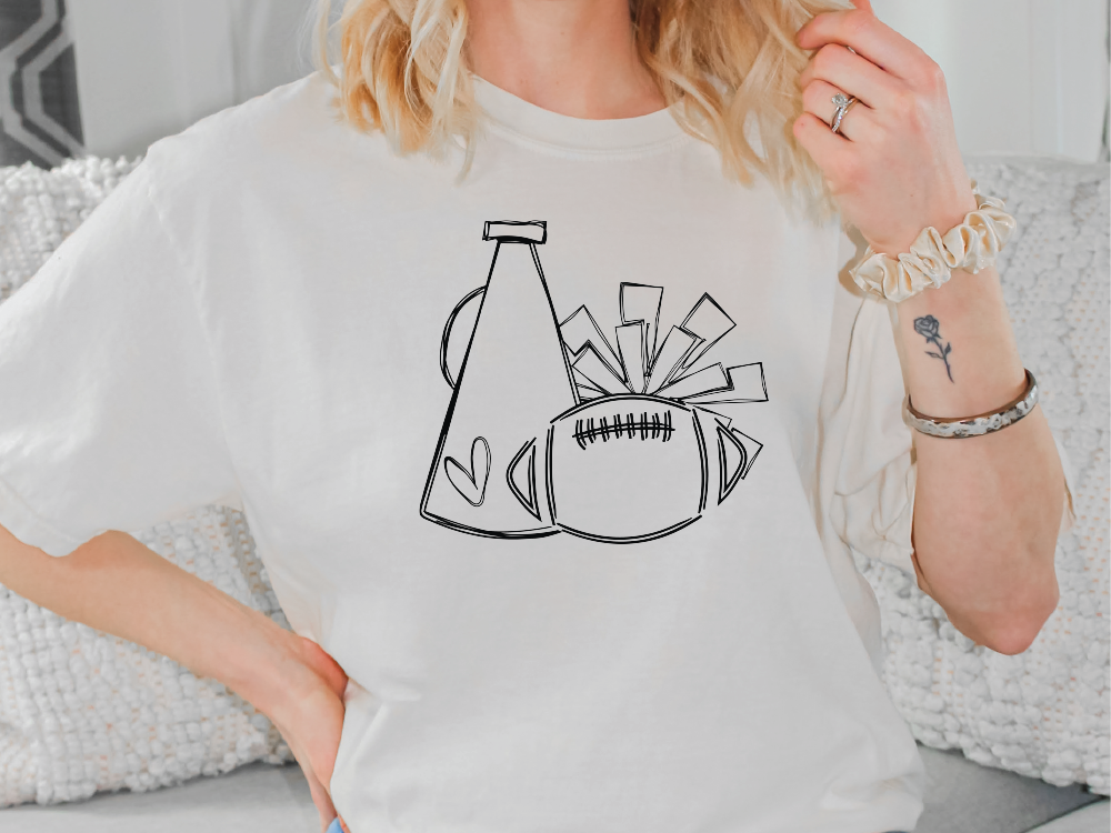 a woman wearing a t - shirt with a graphic of a football and a bottle