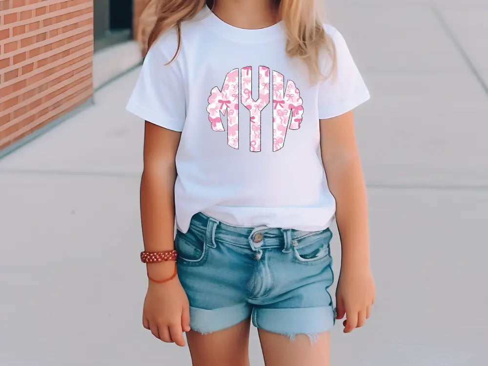 a little girl wearing a white shirt and shorts