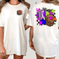A white t-shirt with a colorful graphic design on the back, featuring an eagle and stars.