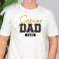 a man wearing a white shirt with the words senior dad printed on it