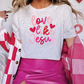 a woman wearing a t - shirt that says love is jesus