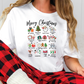 a woman sitting on a chair wearing a white t - shirt that says merry christmas