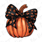 a pumpkin with a black bow and leopard print