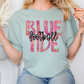 a woman wearing a blue shirt with the words blue tide on it