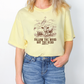 a woman wearing a yellow t - shirt that says follow the word not the head