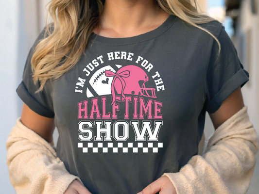 a woman wearing a shirt that says i'm just here for the half time