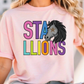 A woman wearing a pink t-shirt with a graphic design of a horse's head and the text "STALLIONS" printed on it.