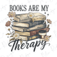 A stack of books with flowers surrounding them, accompanied by the text "Books are my therapy"