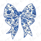A blue floral patterned bow with intricate designs and details.