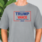 a man standing in front of a plant wearing a trump t - shirt