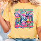 a woman wearing a yellow shirt with a cow on it