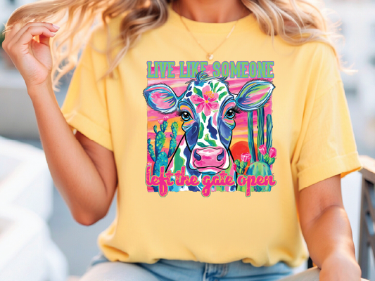 a woman wearing a yellow shirt with a cow on it