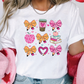 a woman wearing a t - shirt with bows and hearts on it