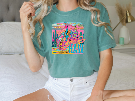 a woman sitting on top of a bed wearing a green shirt
