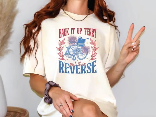 a woman sitting on a chair holding a peace sign