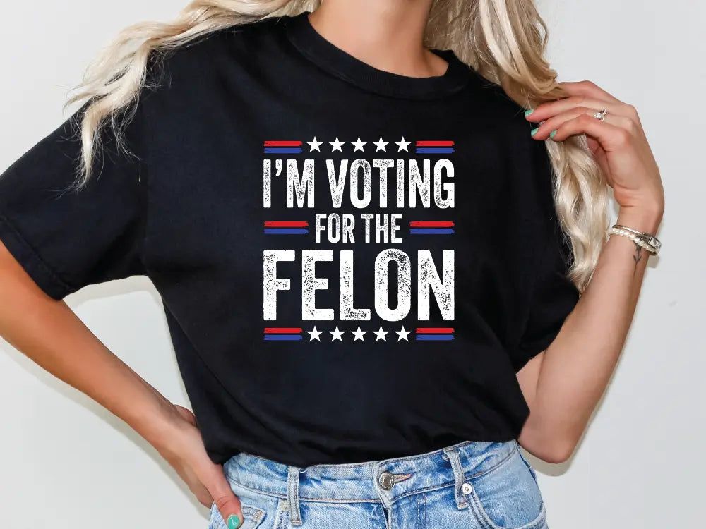 a woman wearing a t - shirt that says i'm voting for the fe