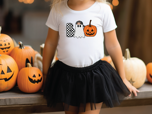 a little girl wearing a white shirt and black skirt