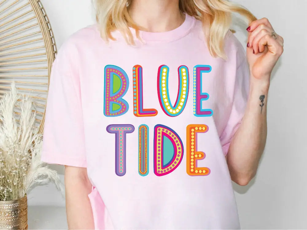 a blonde woman wearing a blue tide t - shirt