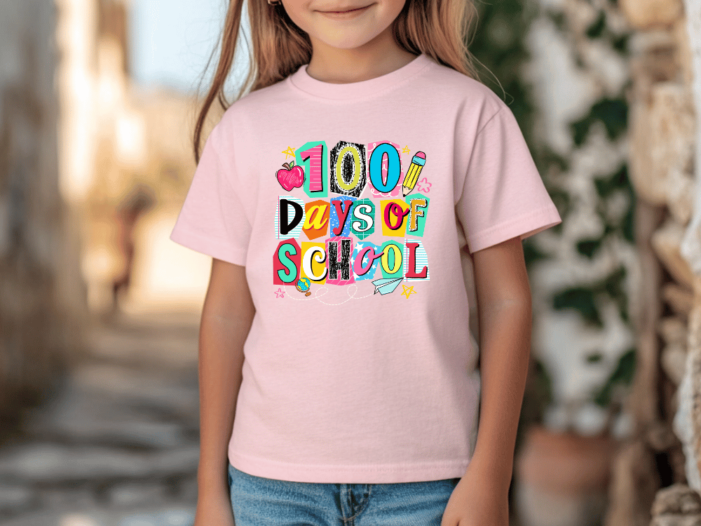 A young girl wearing a pink t-shirt with the text "100 DAYS OF SCHOOL" printed on it.
