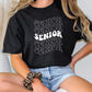 a woman sitting on a table wearing a black shirt with the words senior senior senior