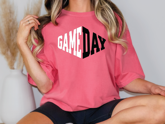 a woman wearing a pink game day shirt