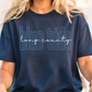 A person wearing a navy blue t-shirt with the text "blue tide" printed on it.