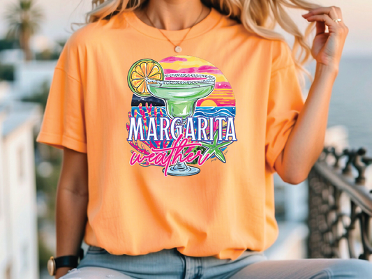 a woman wearing an orange margarita tee shirt