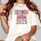 a woman with long red hair wearing a t - shirt that says senior mom 205