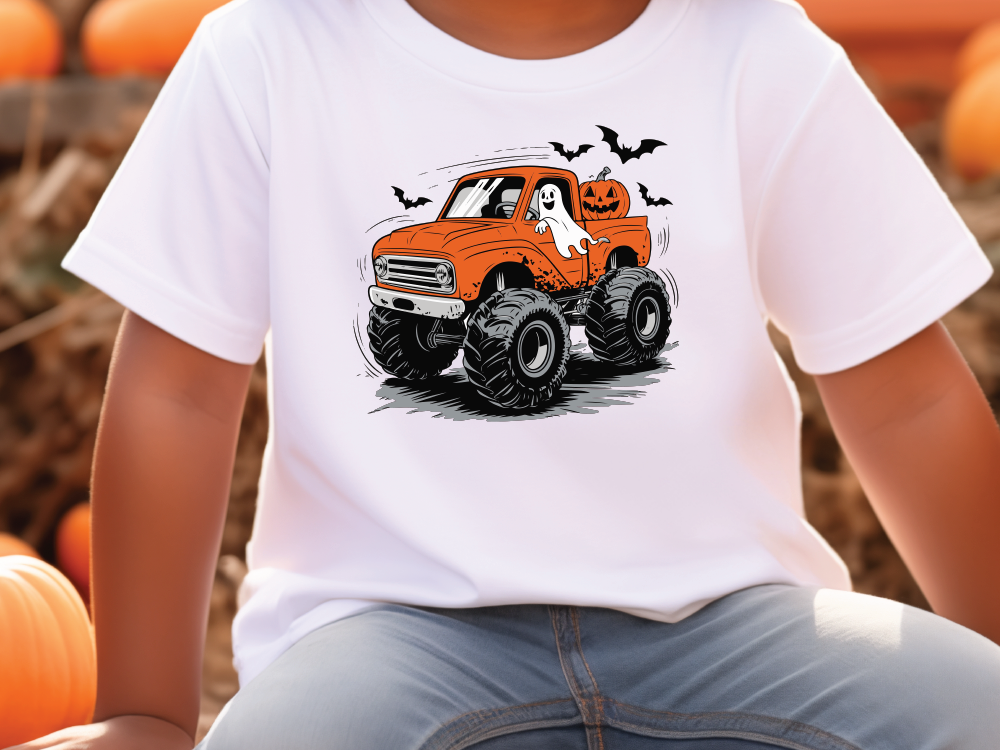 a young boy wearing a white shirt with an orange truck with a ghost on it