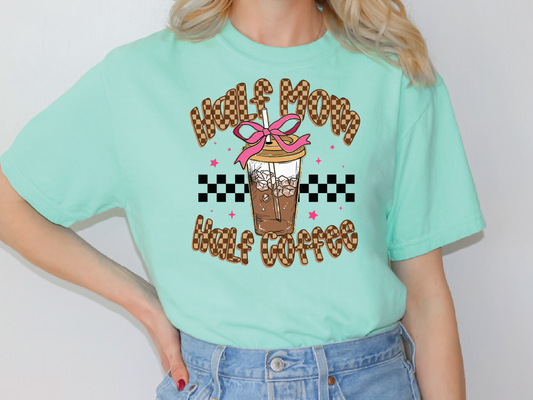 a woman wearing a green t - shirt with a coffee design